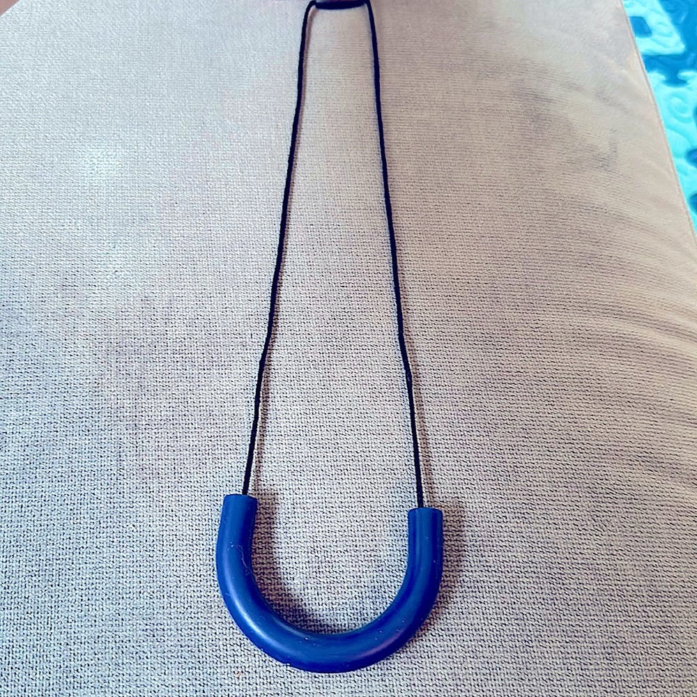 Teething Necklace BRAND NEW comes in packaging and all. Blue u shaped teether